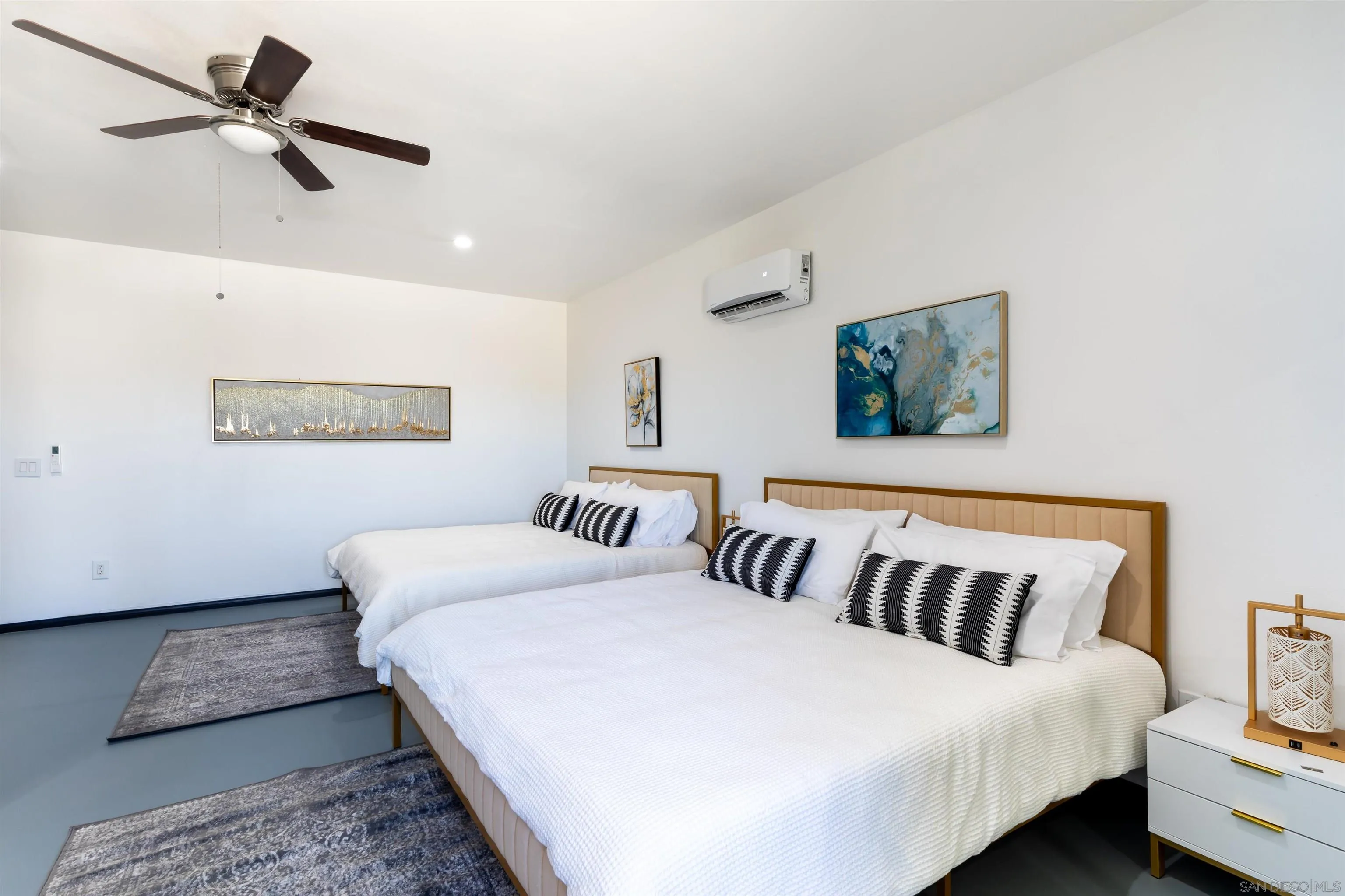 5066 Lear Avenue Twentynine Palms, CA 92277 - Photo 37 of 69 a bedroom with a large bed and a ceiling fan