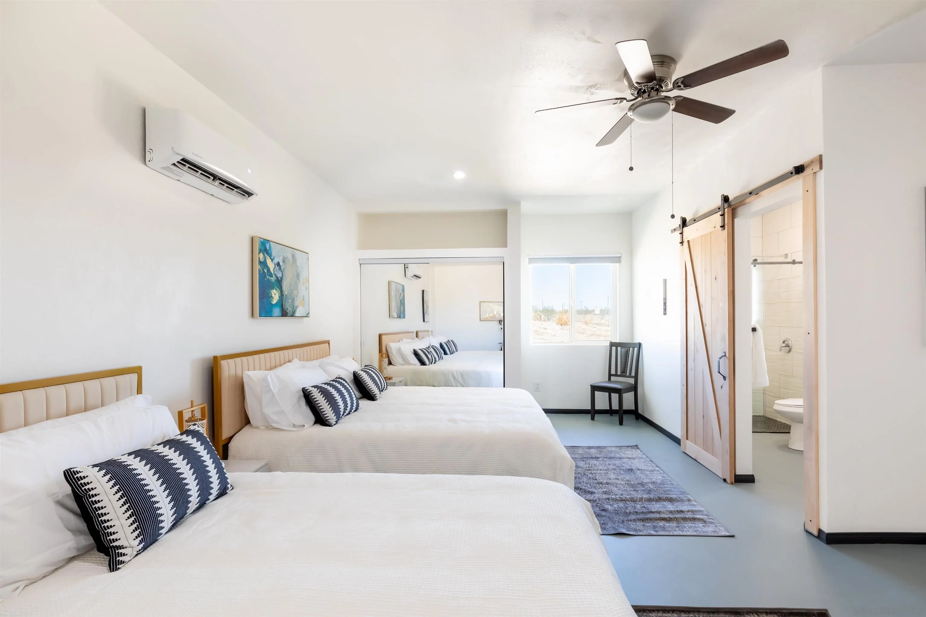 5066 Lear Avenue Twentynine Palms, CA 92277 - Photo 39 of 69 a spacious bedroom with a bed and a walk in closet