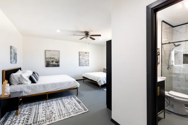 a view of a terrace with a table and chairs under an umbrella