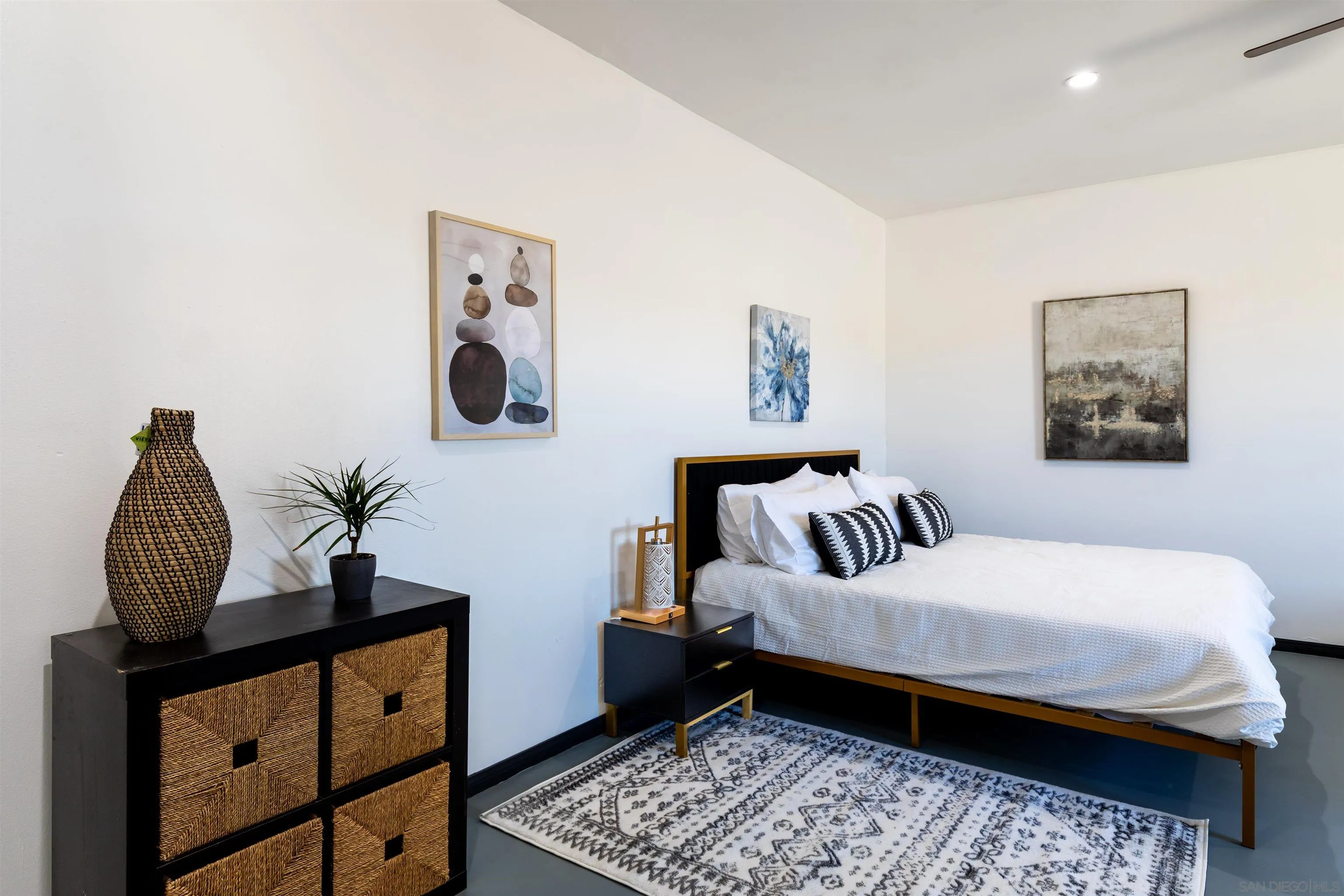 5066 Lear Avenue Twentynine Palms, CA 92277 - Photo 49 of 69 a bedroom with a bed and wooden floor