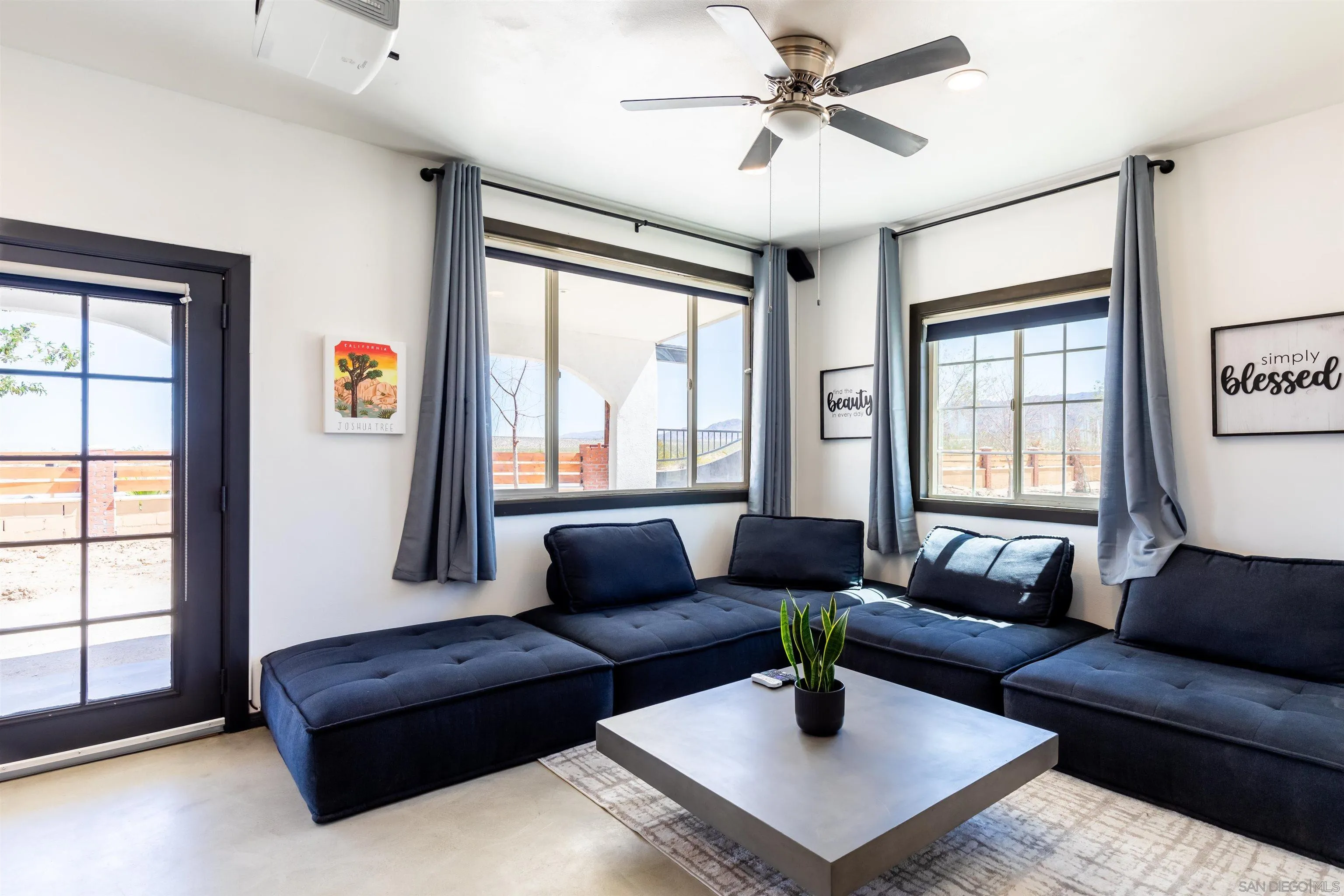 5066 Lear Avenue Twentynine Palms, CA 92277 - Photo 5 of 69 a living room with furniture and a large window
