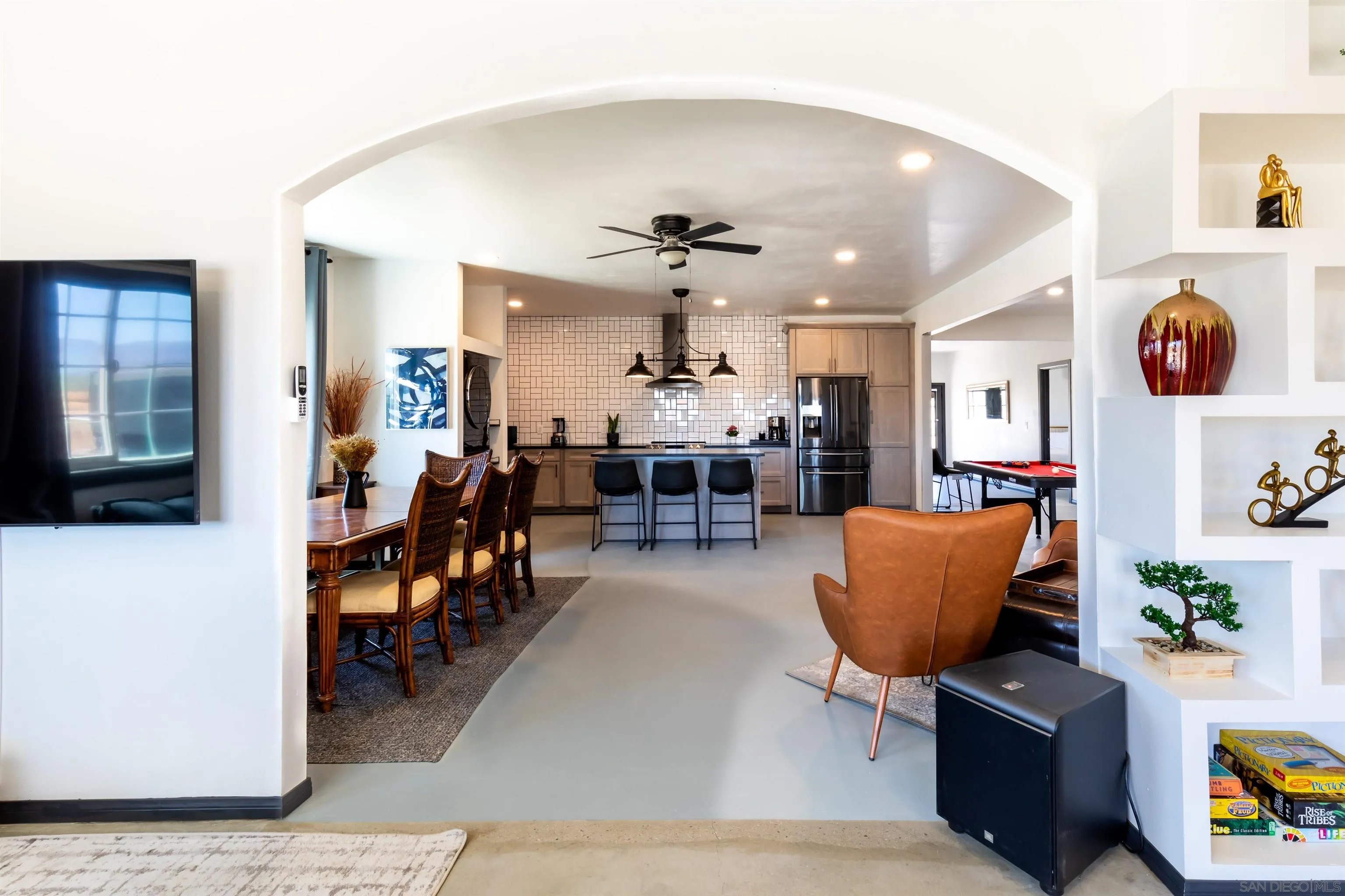 5066 Lear Avenue Twentynine Palms, CA 92277 - Photo 7 of 69 a living room with furniture and a chandelier