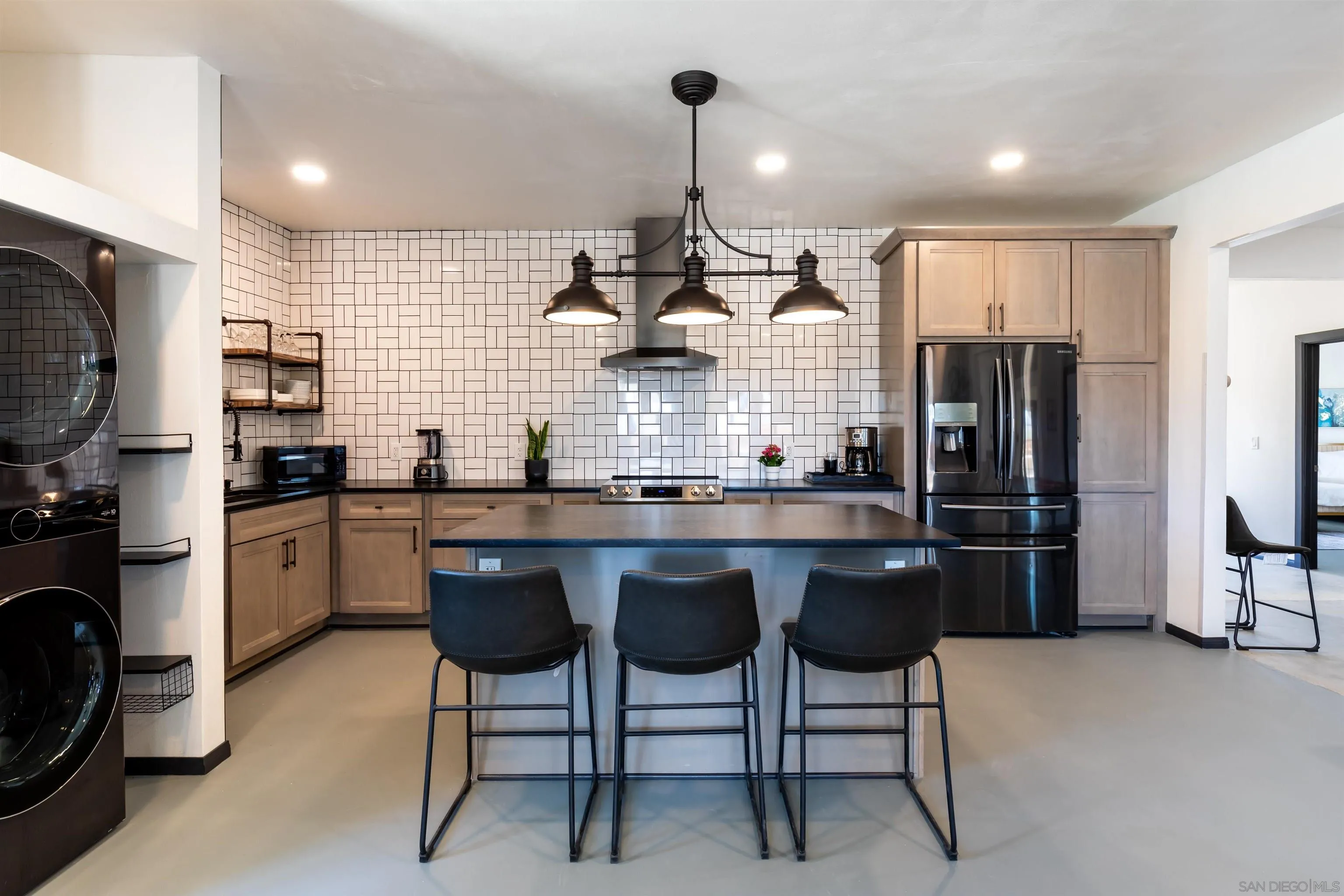 5066 Lear Avenue Twentynine Palms, CA 92277 - Photo 10 of 69 a kitchen with stainless steel appliances granite countertop a sink a stove a refrigerator cabinets and chairs