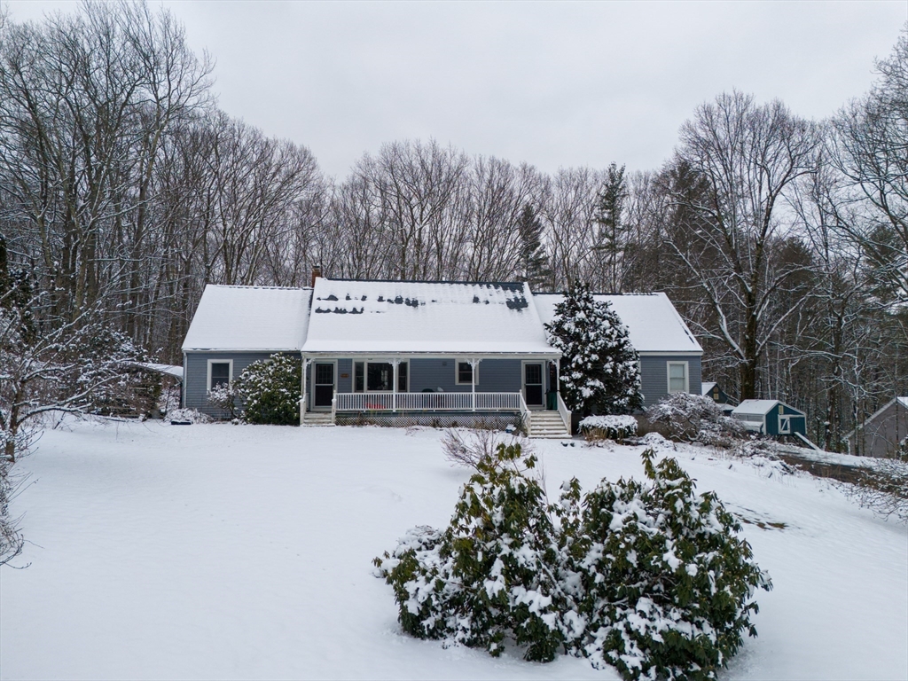 222 Edson Road Oakham, MA 01068 - Photo 3 of 31 a view of a house with a yard covered in snow