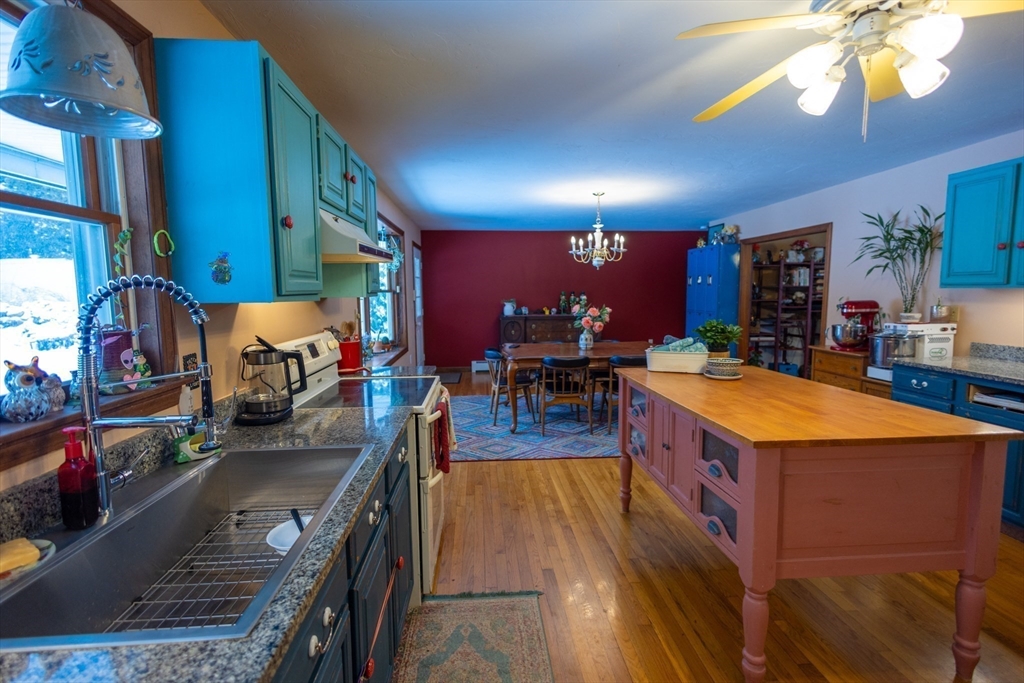 222 Edson Road Oakham, MA 01068 - Photo 9 of 31 a large room with lots of furniture and clutter