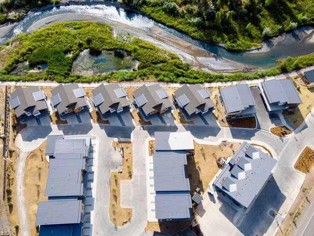 an aerial view of residential house with outdoor space and parking