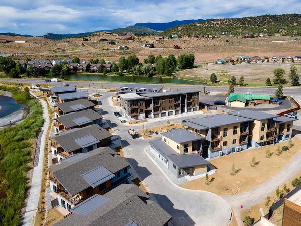 an aerial view of a house with a big yard