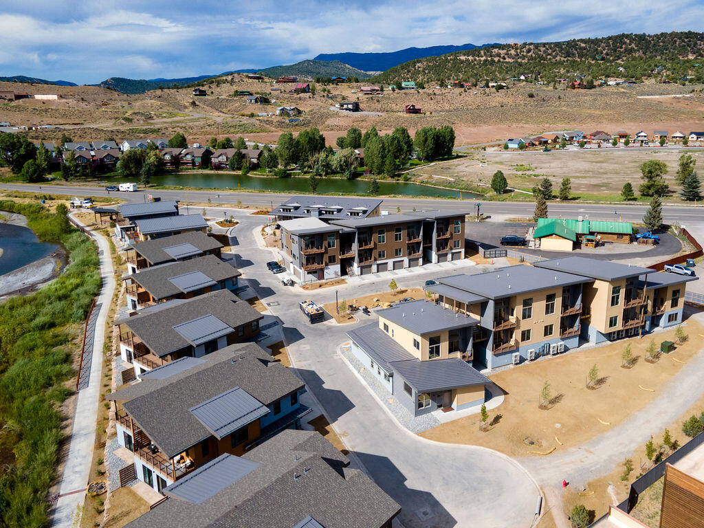 176 Alpine Lane, Unit 300 M2 301 Ridgway, CO 81432 - Photo 7 of 37 an aerial view of a house with a big yard