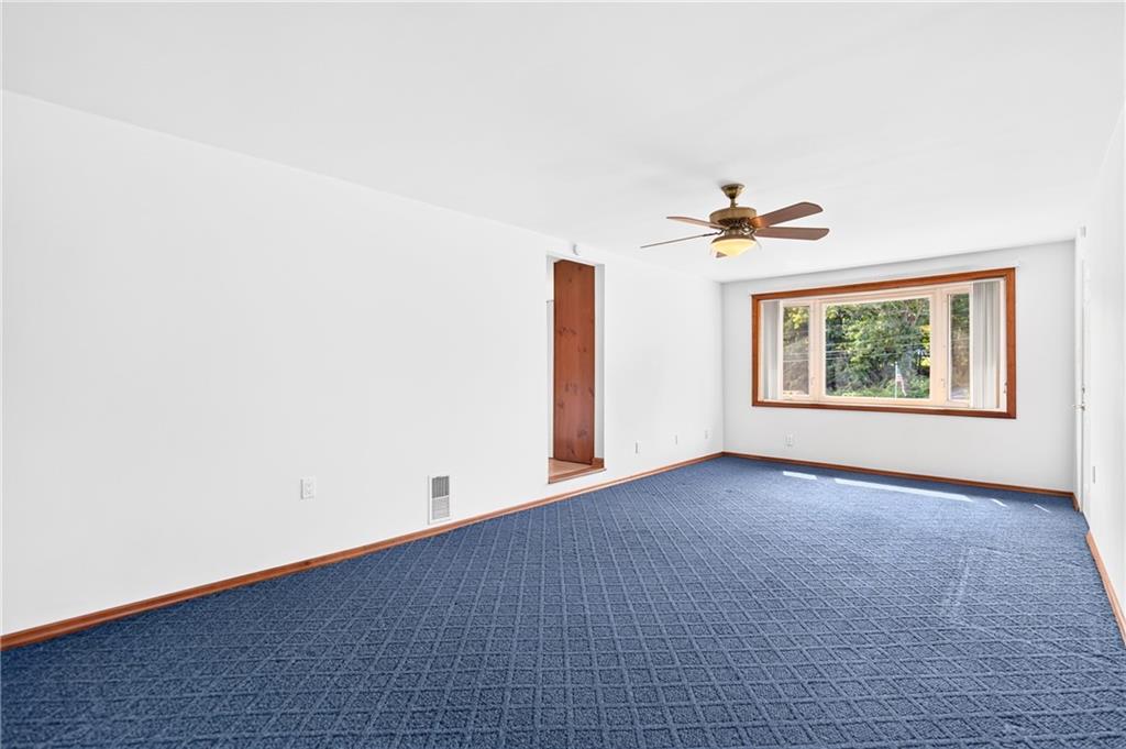 312 Gringo Independence Road, Unit R Aliquippa, PA 15001 - Photo 19 of 49 The spacious additional family room offers a versatile bonus space, beautifully enhanced by a charming bay window that fills the room with natural light.