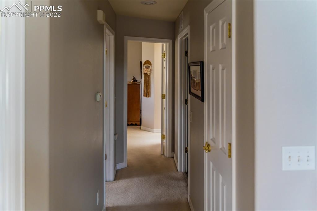 2755 Quail Ridge Point Colorado Springs, CO 80906 - Photo 15 of 35 a view of a bathroom from the hallway