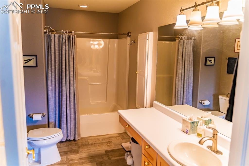 2755 Quail Ridge Point Colorado Springs, CO 80906 - Photo 16 of 35 a bathroom with a sink toilet and shower