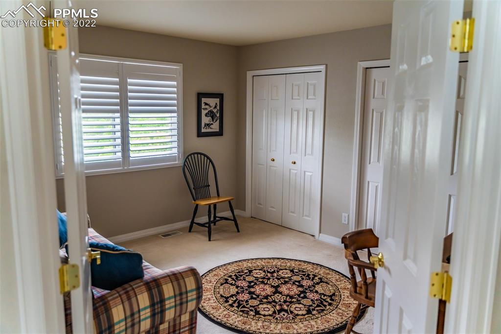 2755 Quail Ridge Point Colorado Springs, CO 80906 - Photo 17 of 35 a view of a workspace with furniture and a window