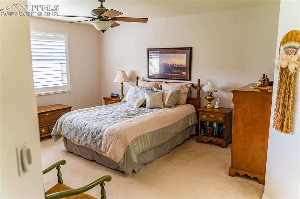 2755 Quail Ridge Point Colorado Springs, CO 80906 - Photo 20 of 35 a bedroom with bed and a window