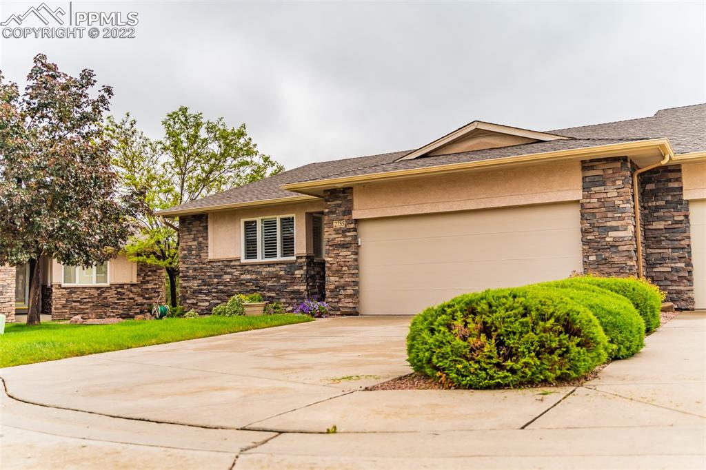 2755 Quail Ridge Point Colorado Springs, CO 80906 - Photo 2 of 35 a view of a house with a yard and pathway