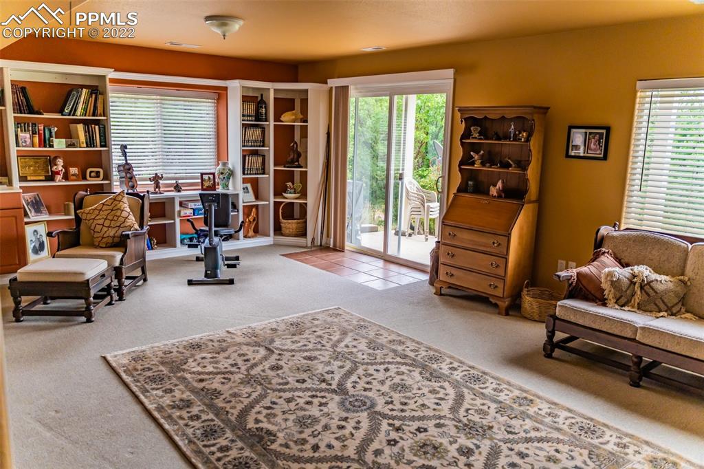 2755 Quail Ridge Point Colorado Springs, CO 80906 - Photo 27 of 35 a living room with furniture and a window