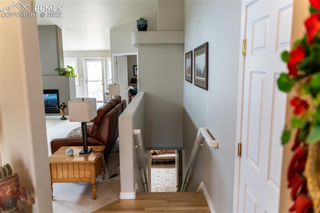 2755 Quail Ridge Point Colorado Springs, CO 80906 - Photo 7 of 35 a view of a hallway with workspace and windows