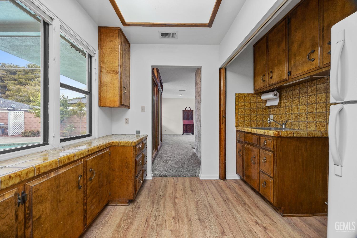 Undisclosed Address Bakersfield, CA 93308 - Photo 17 of 36 a view of a kitchen from a hallway
