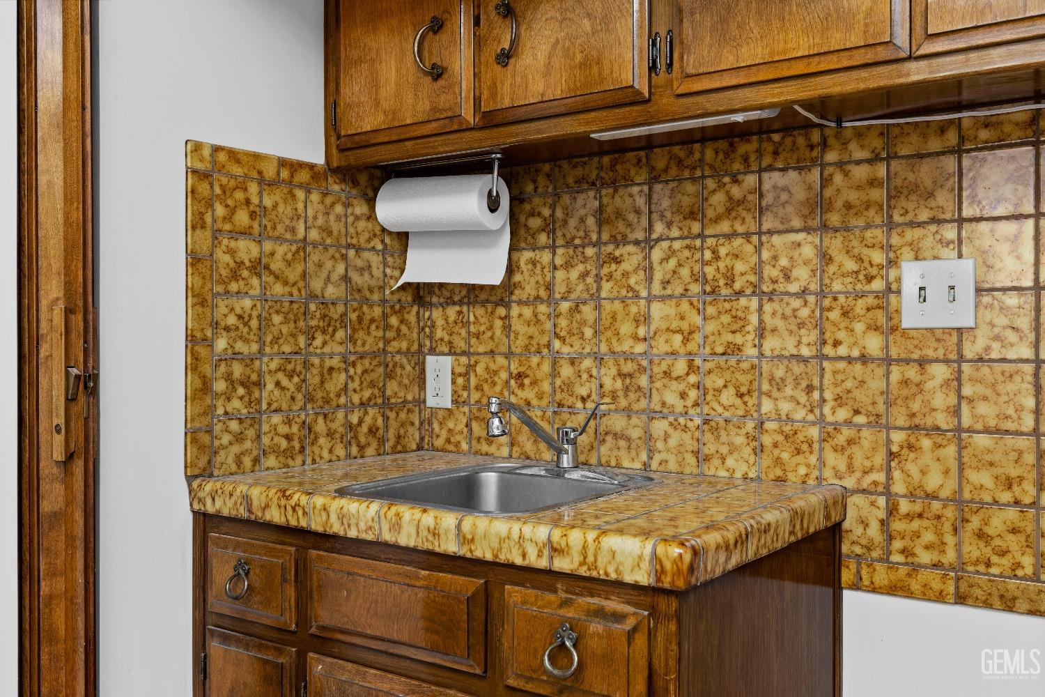 Undisclosed Address Bakersfield, CA 93308 - Photo 18 of 36 a bathroom with a granite countertop sink and a shower