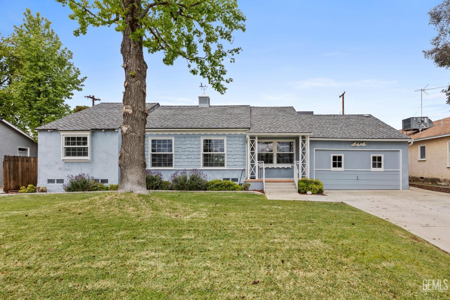Undisclosed Address Bakersfield, CA 93308 - Photo 2 of 36 a front view of house with yard and green space