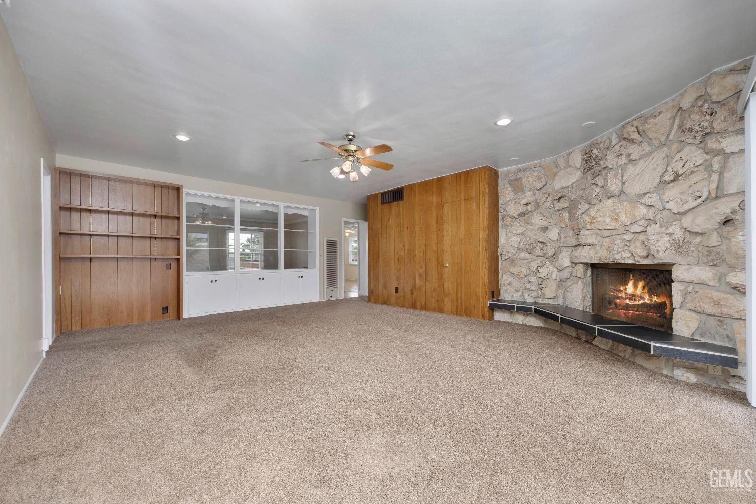 Undisclosed Address Bakersfield, CA 93308 - Photo 22 of 36 a view of an empty room with a fireplace and a window
