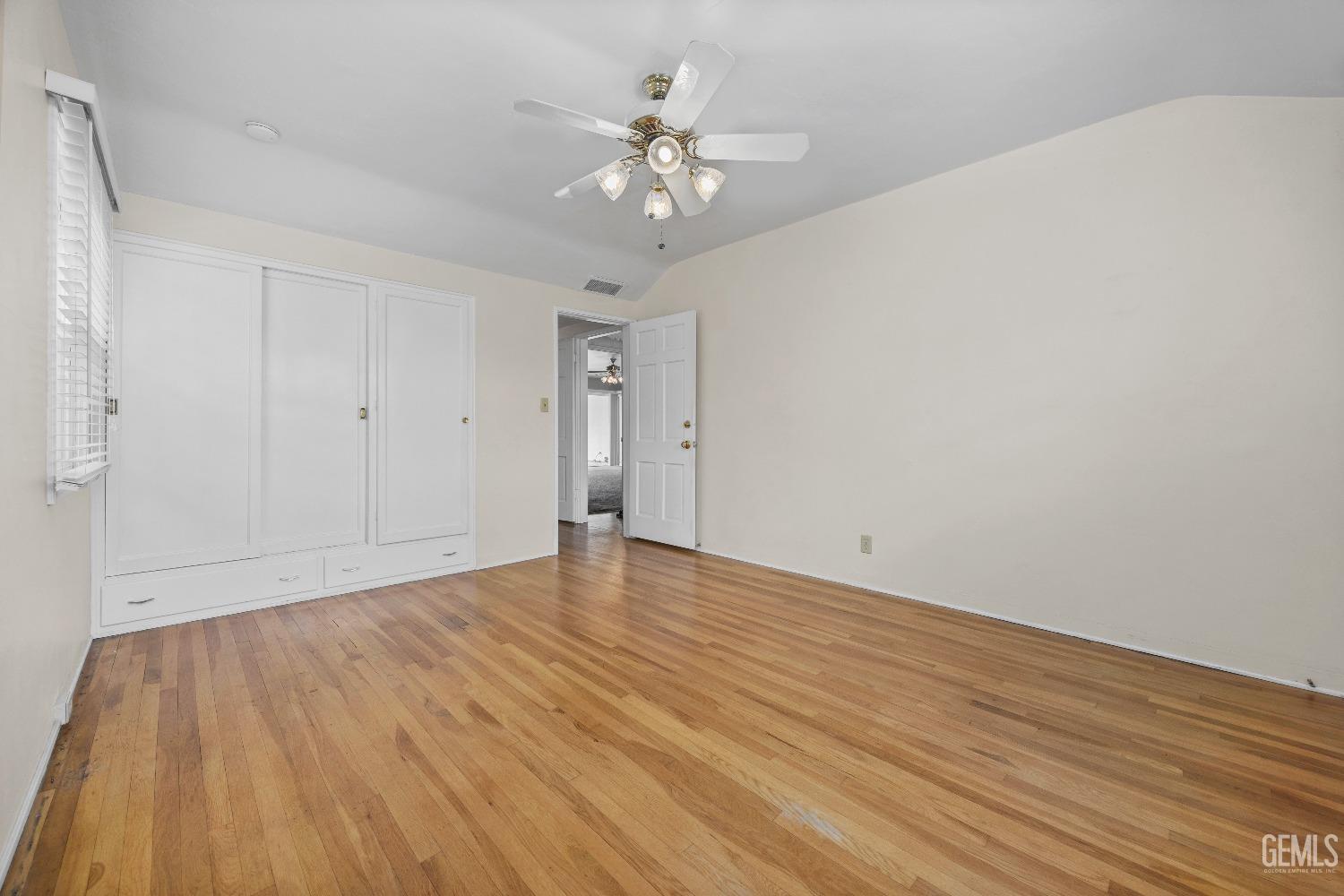 Undisclosed Address Bakersfield, CA 93308 - Photo 25 of 36 a view of an empty room with wooden floor