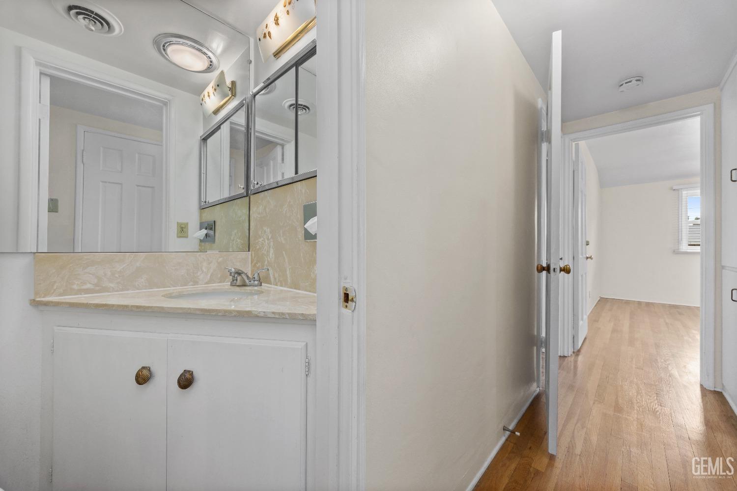 Undisclosed Address Bakersfield, CA 93308 - Photo 26 of 36 a bathroom with a sink and a mirror