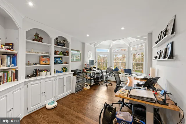 a room with lots of furniture and white walls