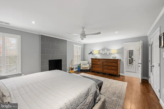 a bedroom with a bed and a fireplace