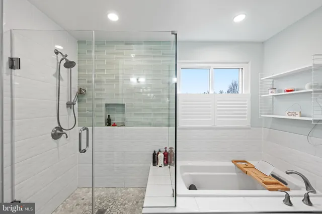 a bathroom with a shower and a tub