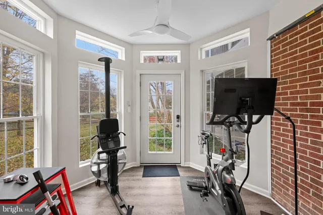 a view of a livingroom with furniture and a window