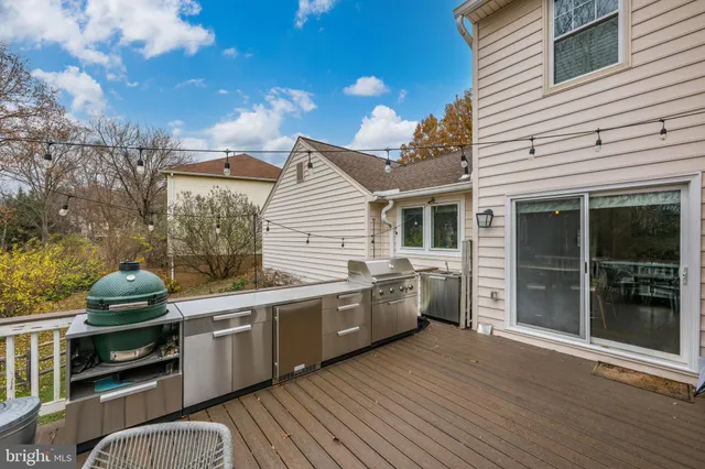 a view of a kitchen with a sink and wooden floor