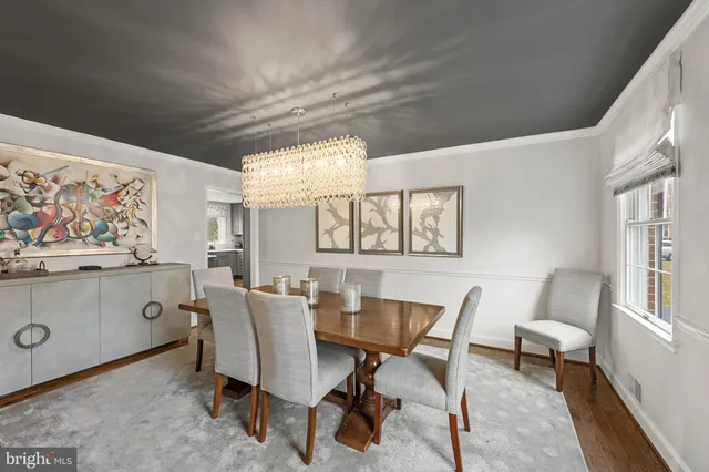 a view of a dining room with furniture and a window