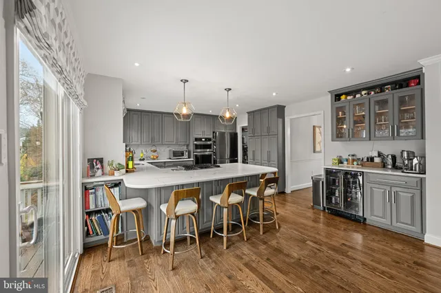 a large kitchen with a table and chairs