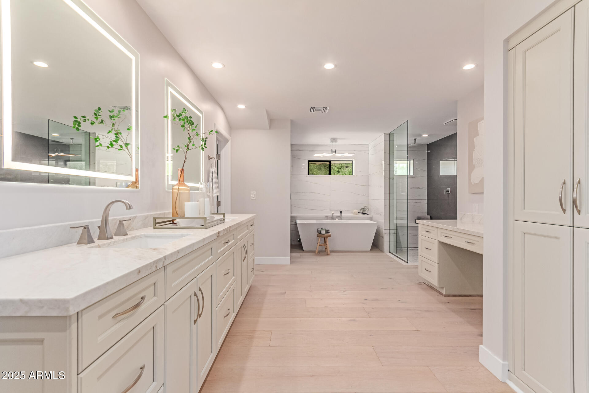 3301 East Rovey Avenue Paradise Valley, AZ 85253 - Photo 40 of 105 a spacious bathroom with a granite countertop sink mirror and a bathtub