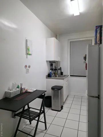 a kitchen with stainless steel appliances kitchen island granite countertop a sink and cabinets