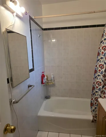 a bathroom with a shower and a bath tub
