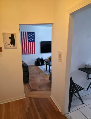 a hallway with table and chairs