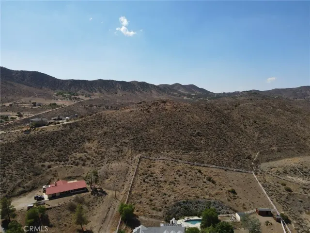 an aerial view of residential house and mountain view