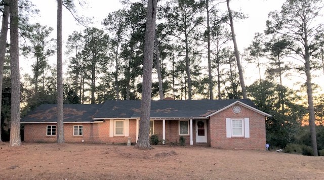 1730 Upper River Road Macon, GA 31211 - Photo 1 of 3 a front view of a house with a tree