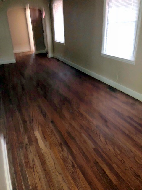 1730 Upper River Road Macon, GA 31211 - Photo 3 of 3 a view of an empty room with wooden floor and a window