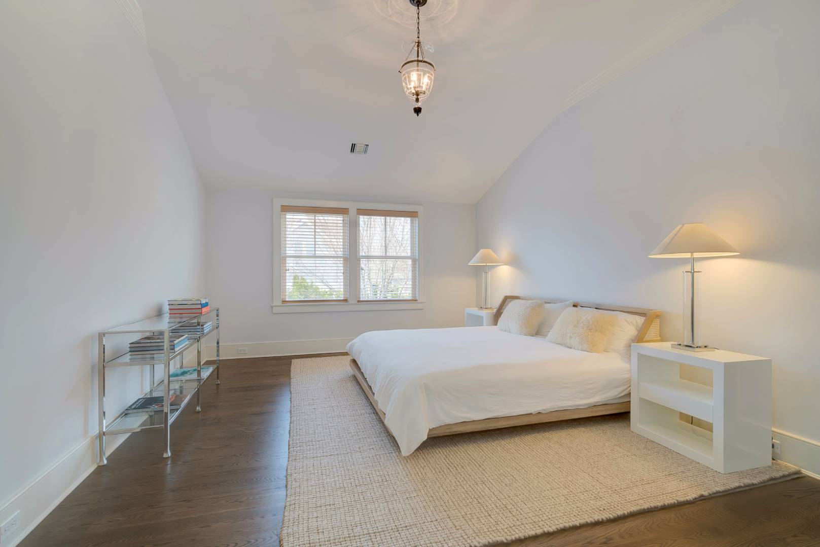 23 Deer Run Water Mill, NY 11976 - Photo 12 of 16 a bedroom with a bed and a lamp with window