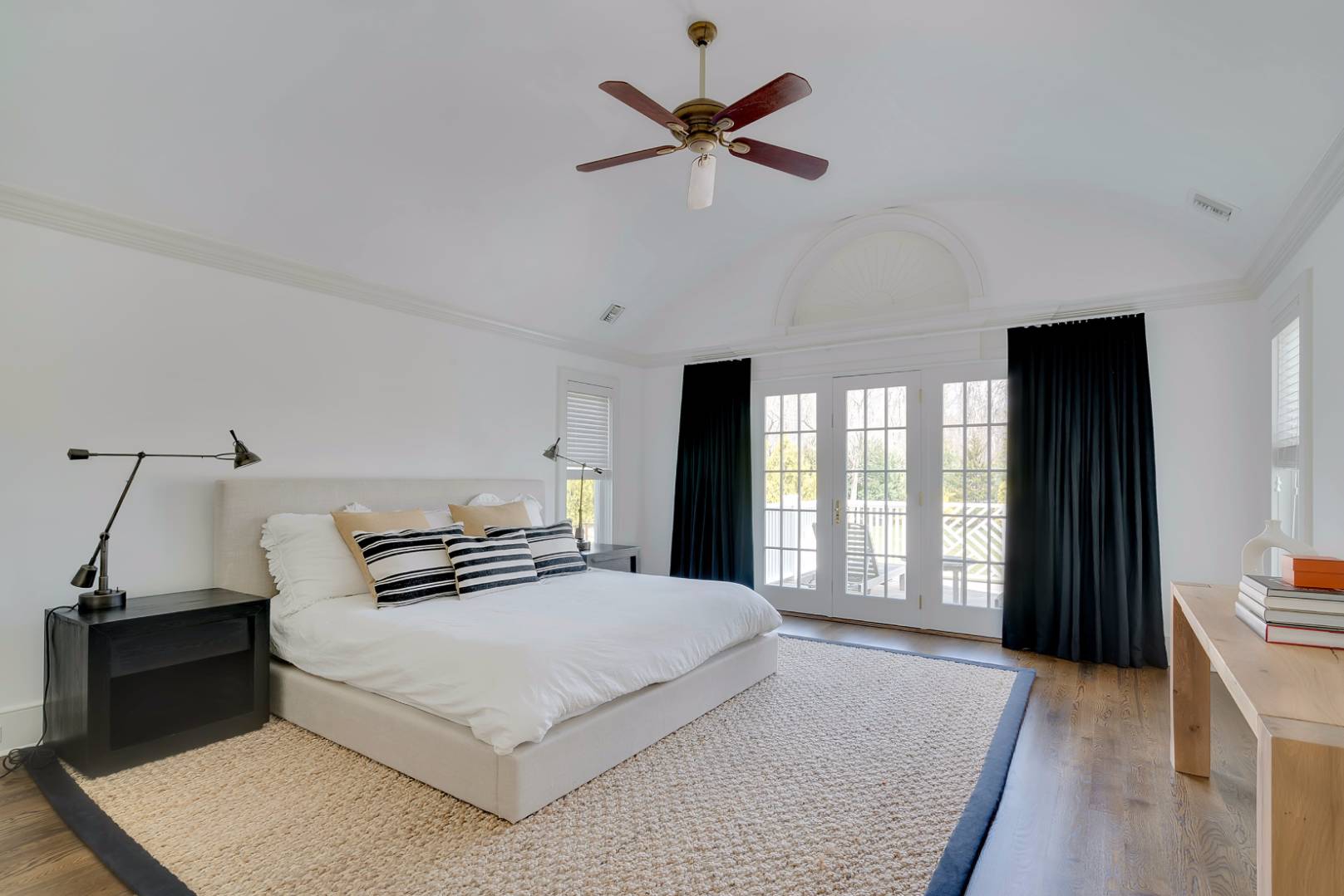 23 Deer Run Water Mill, NY 11976 - Photo 8 of 16 a bedroom with a large bed and a window