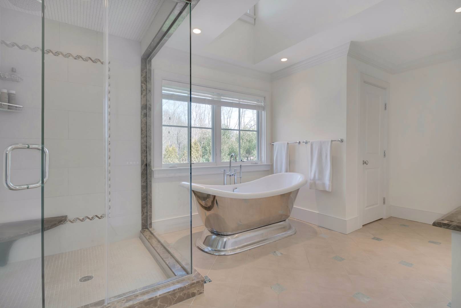 23 Deer Run Water Mill, NY 11976 - Photo 9 of 16 a bathroom with a tub and shower