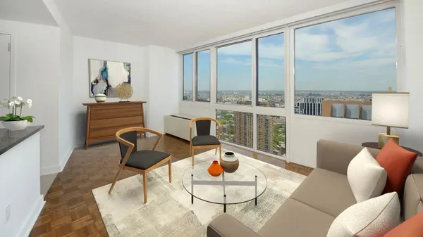 a living room with furniture and a floor to ceiling window