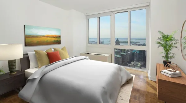 a bedroom with a large bed and a fireplace