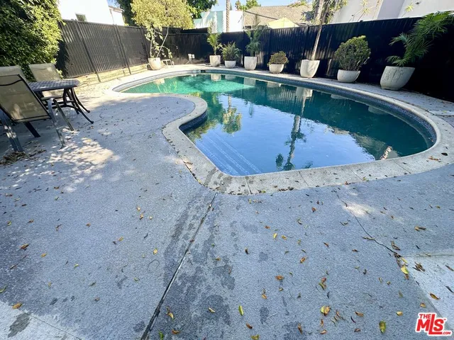 a view of swimming pool with seating space
