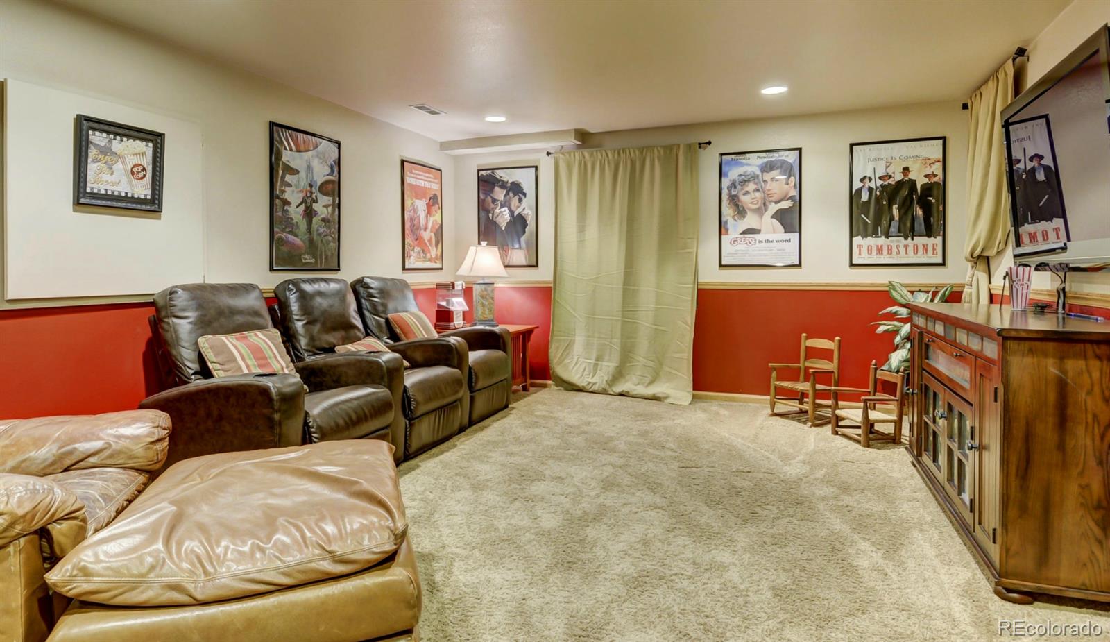 9932 South Spring Hill Place Highlands Ranch, CO 80129 - Photo 26 of 31 a living room with furniture and a flat screen tv