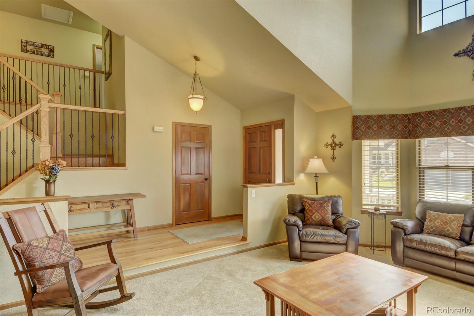9932 South Spring Hill Place Highlands Ranch, CO 80129 - Photo 5 of 31 a living room with furniture and a rug