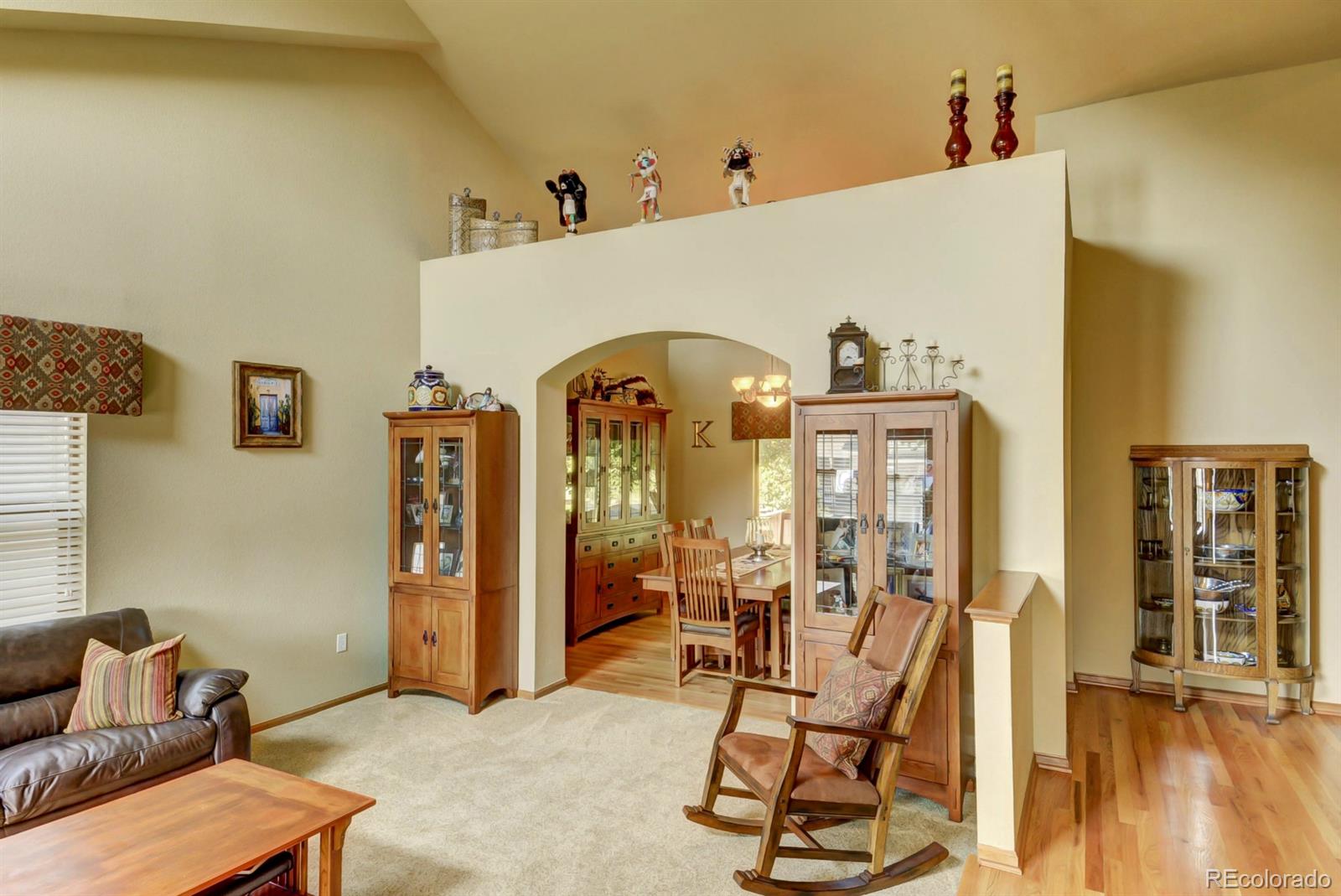9932 South Spring Hill Place Highlands Ranch, CO 80129 - Photo 6 of 31 a view of a livingroom with furniture and windows