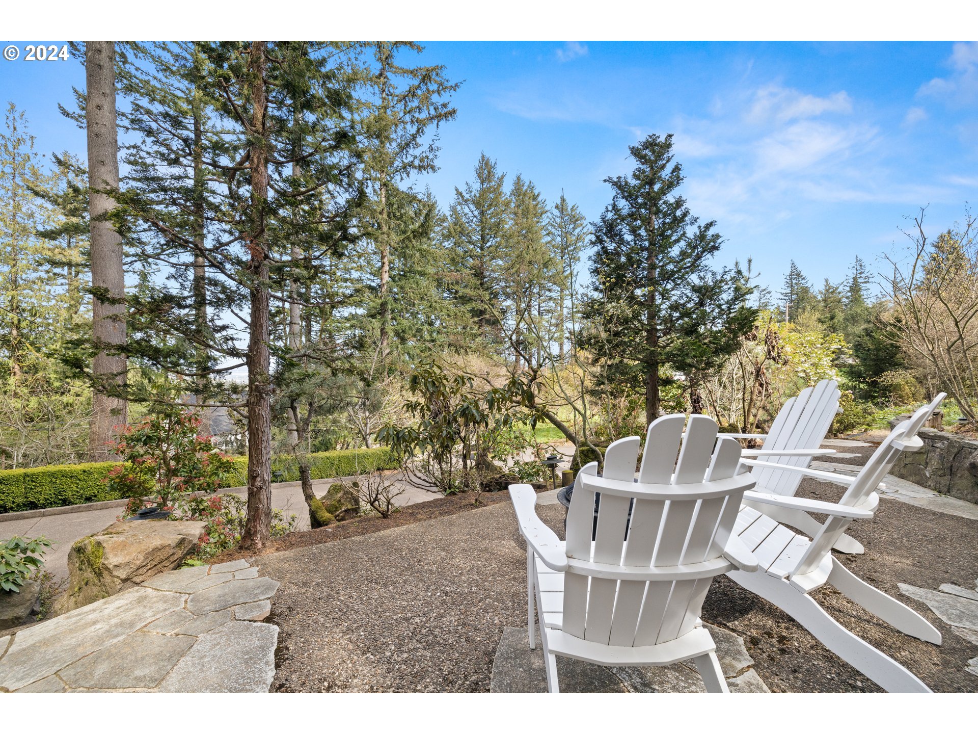 495 Northwest Greenleaf Road Portland, OR 97229 - Photo 36 of 45 a view of a chairs and table in the backyard